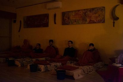The participants relax as they wait for the effects of the first ayahuasca shot.