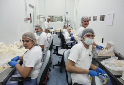 Staff at the Antojos Araguaney factory in Rivas-Vaciamadrid making ‘tequeños’ – breaded cheese sticks that are popular in Venezuela.