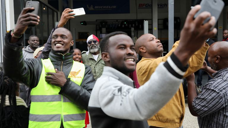 Supporters take selfies with Kenyan presidential candidate George Wajackoyah in Karen, Kenya, August 3, 2022. REUTERS/Baz Ratner 