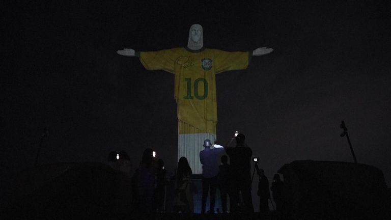Rio de Janeiro's iconic Christ the Redeemer statue donned Pele's bright-yellow Brazil jersey on Friday night to honour the first anniversary of the football legend's death.