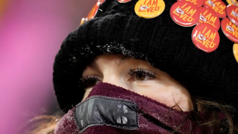 Frost is shown on the eyelashes and hat of a fan watching during the second half of an NFL wild-card playoff football game between the Kansas City Chiefs and the Miami Dolphins Saturday, Jan. 13, 2024, in Kansas City, Mo. (AP Photo/Charlie Riedel)