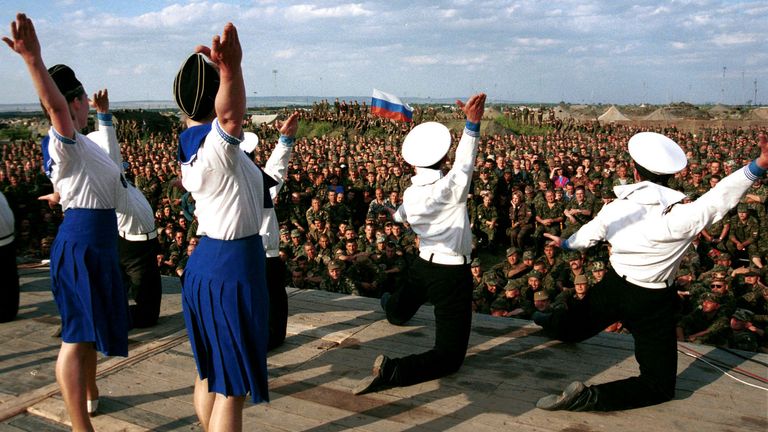 A troupe of dancers perform for troops at a base in Khankala, on the outskirts of the Chechen capital Grozny. Pic: Reuters
