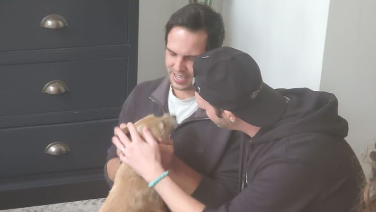 Milo with his owners. Pic: Family photo