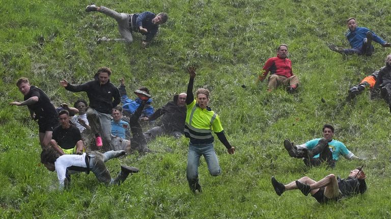 Pic: PA Participants take part in the annual cheese rolling at Cooper's Hill in Brockworth, Gloucestershire. Picture date: Monday May 27, 2024.