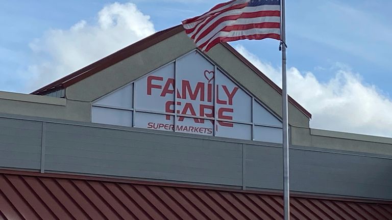 A Family Fare store is shown in Midland, Mich., Thursday, May 9, 2024. Contractors curious about an extension cord on the roof of a Michigan grocery store made a startling discovery: A 34-year-old woman was living inside the business sign, with enough space for a computer, printer and coffee maker, police said. (Heather Jordan/Saginaw News via AP)