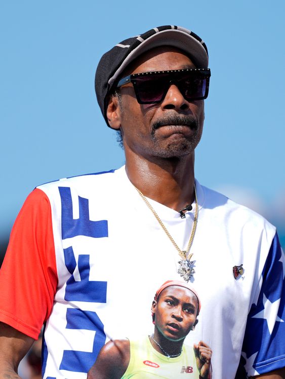 US artist Snoop Dogg wears a T-shirt with a picture of tennis player Coco Gauff while attending the men's skateboard street final at the 2024 Summer Olympics, Monday, July 29, 2024, in Paris, France. (AP Photo/Frank Franklin II)