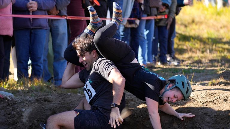 Nic Vinsonhaler looses his footing while carrying Tara Rogowski. Pic: AP Photo/Robert F Bukaty