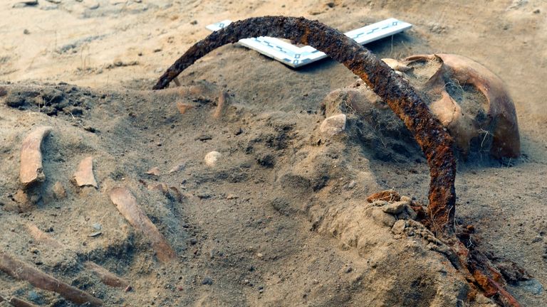 The skeleton of Zosia, a woman buried as a vampire, lies in a grave in Pien, Poland, August 2022. Nicolaus Copernicus University, Torun/Handout via REUTERS THIS IMAGE HAS BEEN SUPPLIED BY A THIRD PARTY NO RESALES. NO ARCHIVES. MANDATORY CREDIT.