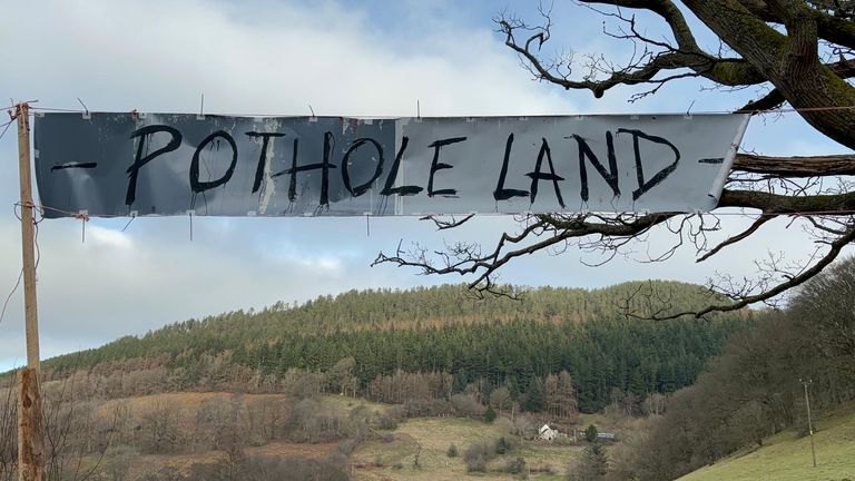 A sign advertising "Pothole Land" in Wrexham